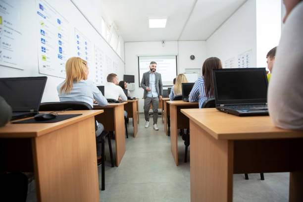 istock Group of students with their driving instructor, classroom concept 1286326264
