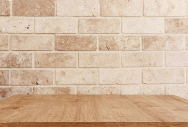 istock Room interior of brick wall and table for mock up or display 1286328025