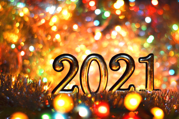istock 2021 figures on a bright background holiday lights New year Christmas 1286328203