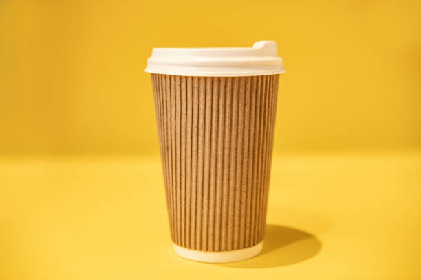 istock Empty craft glass for coffee on a yellow background. 1286328516