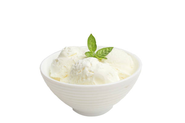 istock white bowl with white ice cream and green leaf isolated on white. 1286329850