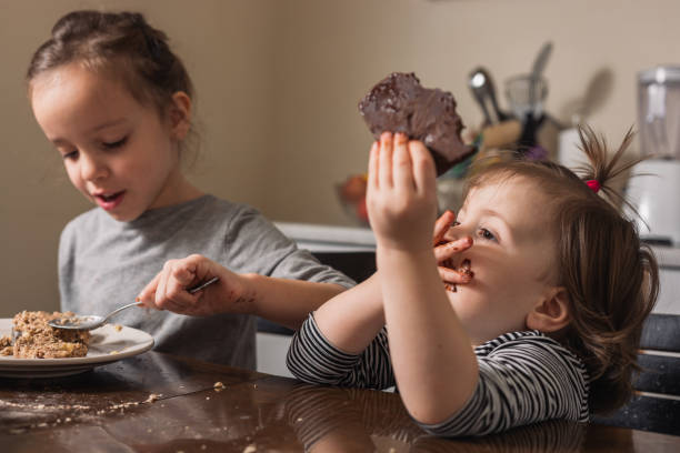 istock Children making cookies at home 1286329906