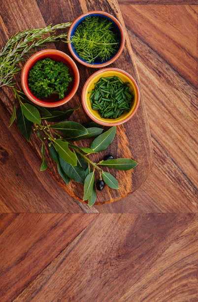 istock Three different tasty herbs on a rustic wooden board with copy space 1286332156