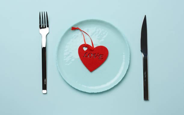 istock red heart lies in a blue round ceramic plate 1286332385