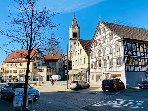 Sulzbach, Germany - November, 18 - 2020: Gasthof Krone and church behind this inn at the market square,
