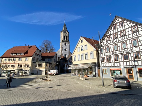 Sulzbach, Germany - November, 18 - 2020: Gasthof Krone and church behind this inn at the market square,