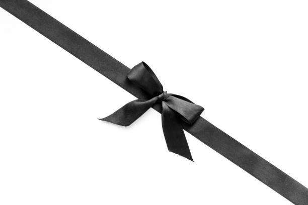 istock Black ribbon with bow isolated on white. Top view, copy space 1286332648