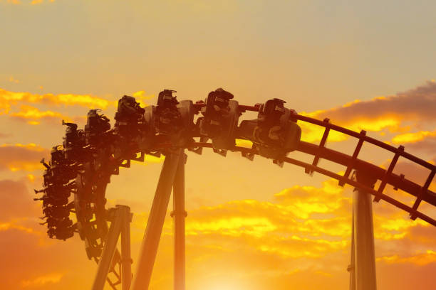 istock Roller coaster in the amusement park with the sunset background. 1286333797