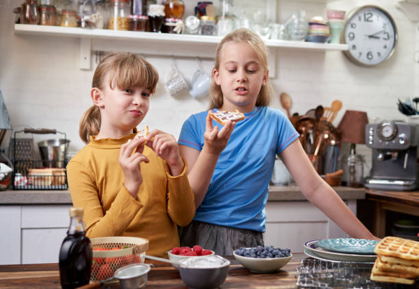 istock Cooking at Home Kids Making Waffles in Domestic Kitchen 1286333961