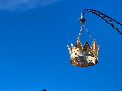 Golden crown on blue sky