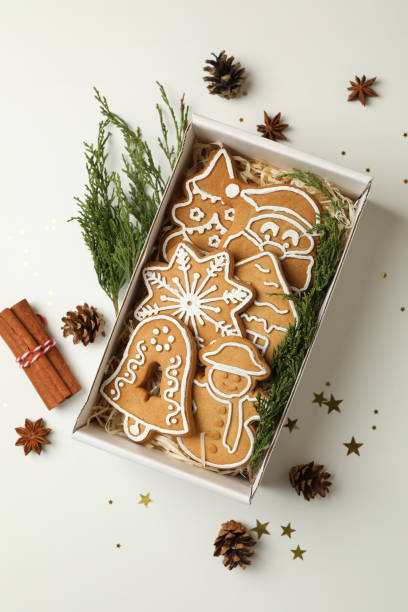 istock Box with tasty Christmas cookie on white background 1286334286
