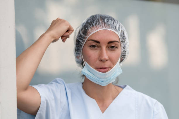 woman doctor during a work break - nurse hygiene emotional stress surgeon imagens e fotografias de stock
