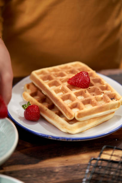 istock Cooking at Home Kids Making Waffles in Domestic Kitchen 1286335292