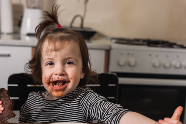 istock Girl eating chocolate 1286335685