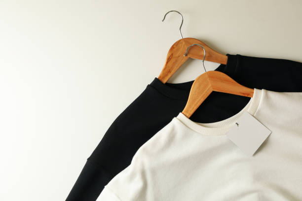 istock Hangers with stylish sweatshirts on white background 1286335728