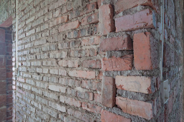 istock A room in a rough house under construction, with a red brick concrete structure 1286335759
