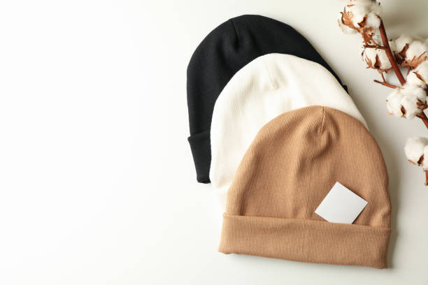 istock Stylish beanies and cotton on white background 1286335981