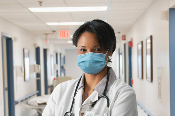 Nurse wearing mask at the hospital stock photo