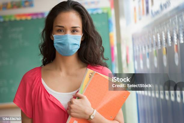 Teacher Wearing Mask At School Stock Photo - Download Image Now - Teacher, Coronavirus, Elementary School