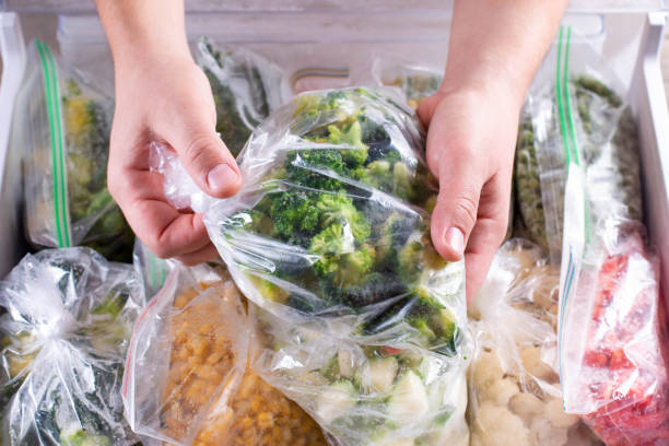 istock Frozen broccoli. Frozen vegetables in a plastic bag in refrigerator 1286337231