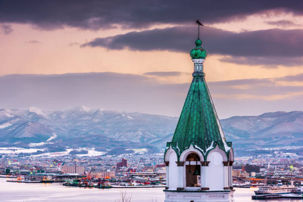 Hakodate, Japan orthodox church and cityscape at twilight in winter.