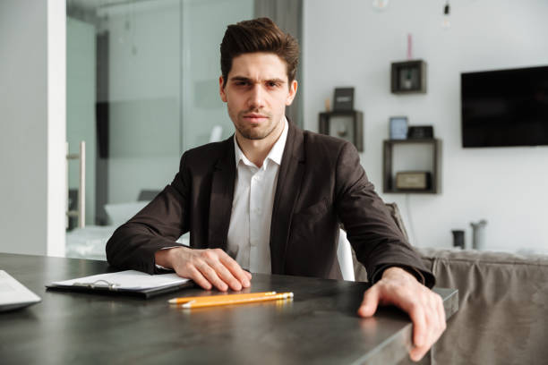istock Serious young businessman working indoors. 1286339563