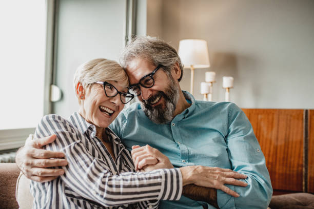 istock Senior couple embracing at home 1286339939