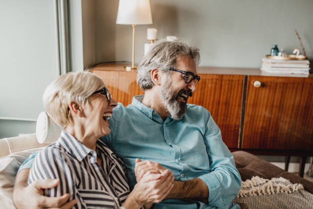 istock Senior couple embracing at home 1286339950