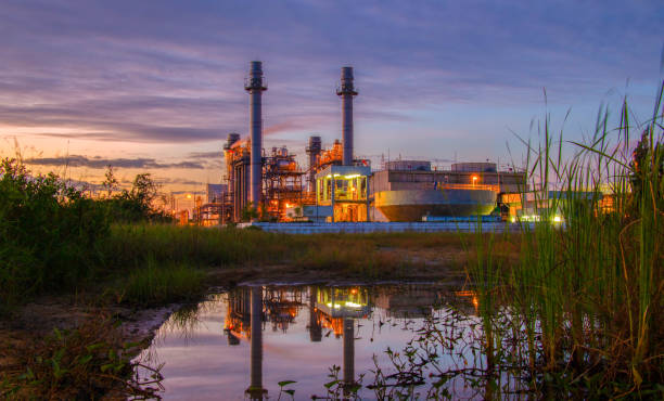 natural gas combined cycle power plant with sunset and light orange - boiler power station fuel and power generation gas boiler imagens e fotografias de stock