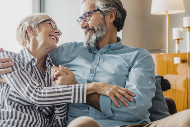 istock Senior couple embracing at home 1286340153