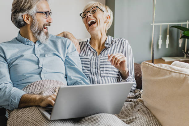 istock Seniors are using laptop at home 1286340748