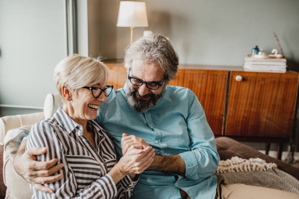 istock Senior couple embracing at home 1286340808