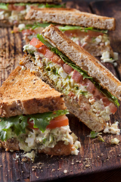 istock Avocado and Egg Salad Sandwich with Crispy Bacon, Lettuce and Tomato 1286345746