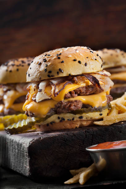 Double Cheese Burger Sliders with Fried Onions, Pickles on a Brioche Sesame Seed Bun with Fries