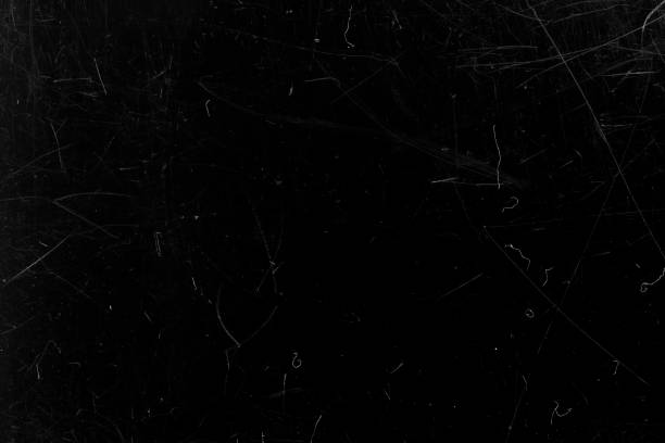istock Black film with scratches. Abstract background. 1286348697