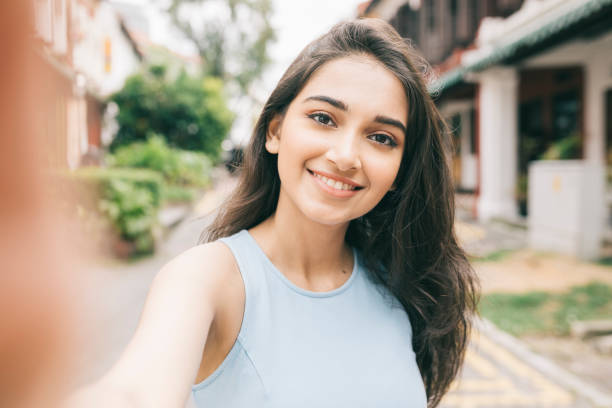 istock Happy woman taking a self portrait 1286350686