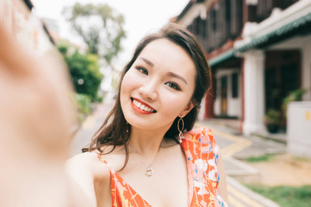 istock Happy woman taking a self portrait 1286350691