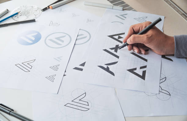 istock Graphic designer creative design sketch drawing logo Trademark brand Workspace 1286351411