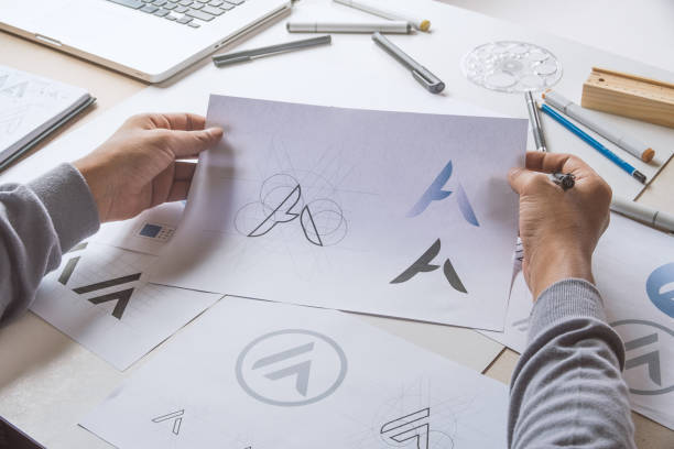 istock Graphic designer creative design sketch drawing logo Trademark brand Workspace 1286351412