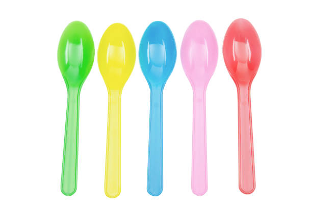 top view of plasic fork and spoon in a paper cup