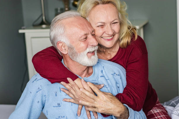 istock Seniors embracing in bed 1286351992
