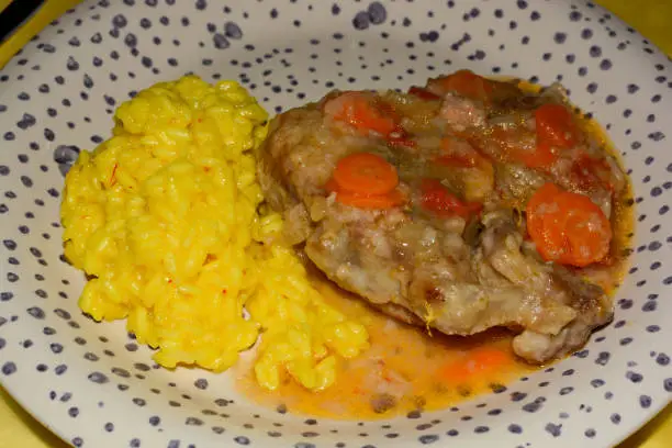 homemade marrowbone with the grandmother's recipe of carrots, celery, tomatoes and slow cooking