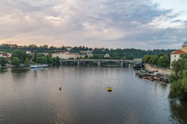 istock Panoramic view of Vltava river in Prague at sunset time. 1286356137