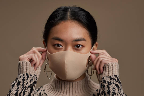 istock Asian woman in mask 1286357687