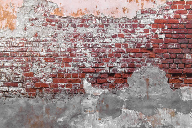 istock Close-up concrete exterior cracked seamless pattern dirty plaster brick texture. 1286359465