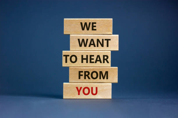 Wooden blocks with words 'we want to hear from you'. Beautiful grey background. Copy space. Business concept. Wooden blocks with words 'we want to hear from you'. Beautiful grey background. Copy space. Business concept. listening stock pictures, royalty-free photos & images
