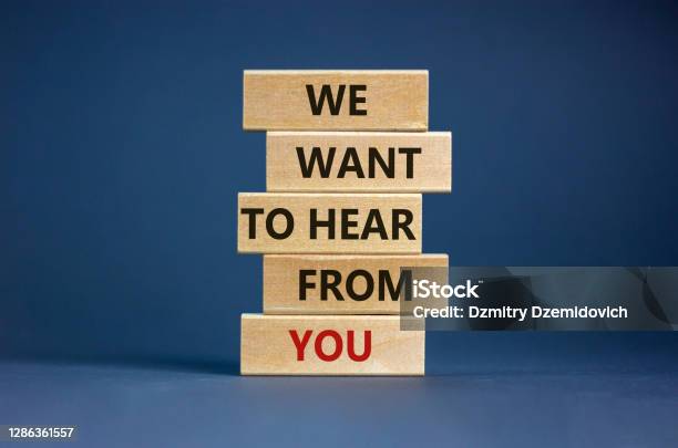 Wooden Blocks With Words We Want To Hear From You Beautiful Grey Background Copy Space Business Concept Stock Photo - Download Image Now