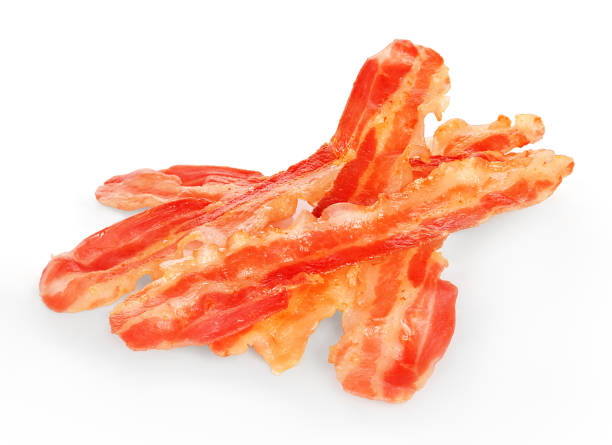 istock Strips of fried bacon closeup isolated on a white background. 1286362215