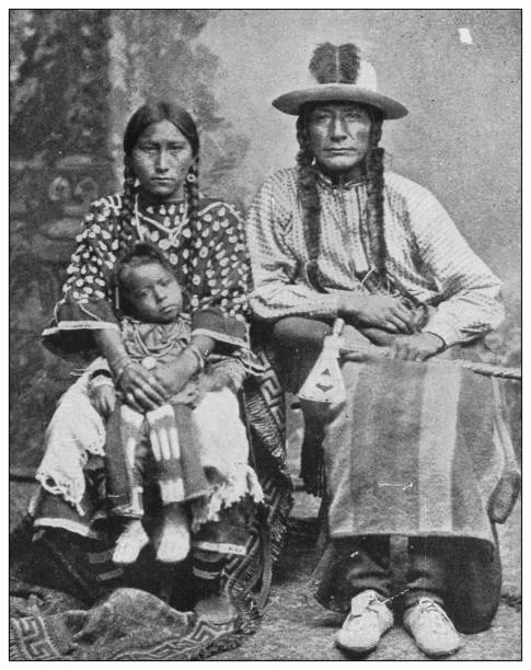 Antique black and white photo of the United States: Crooked Face and his family Antique black and white photo of the United States: Crooked Face and his family indigenous north american culture photos stock illustrations