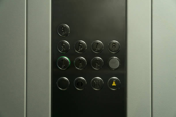 istock Elevator button control panel closeup. Disinfection, cleanliness and health care, anti corona virus, COVID-19. Selective focus. 1286362955